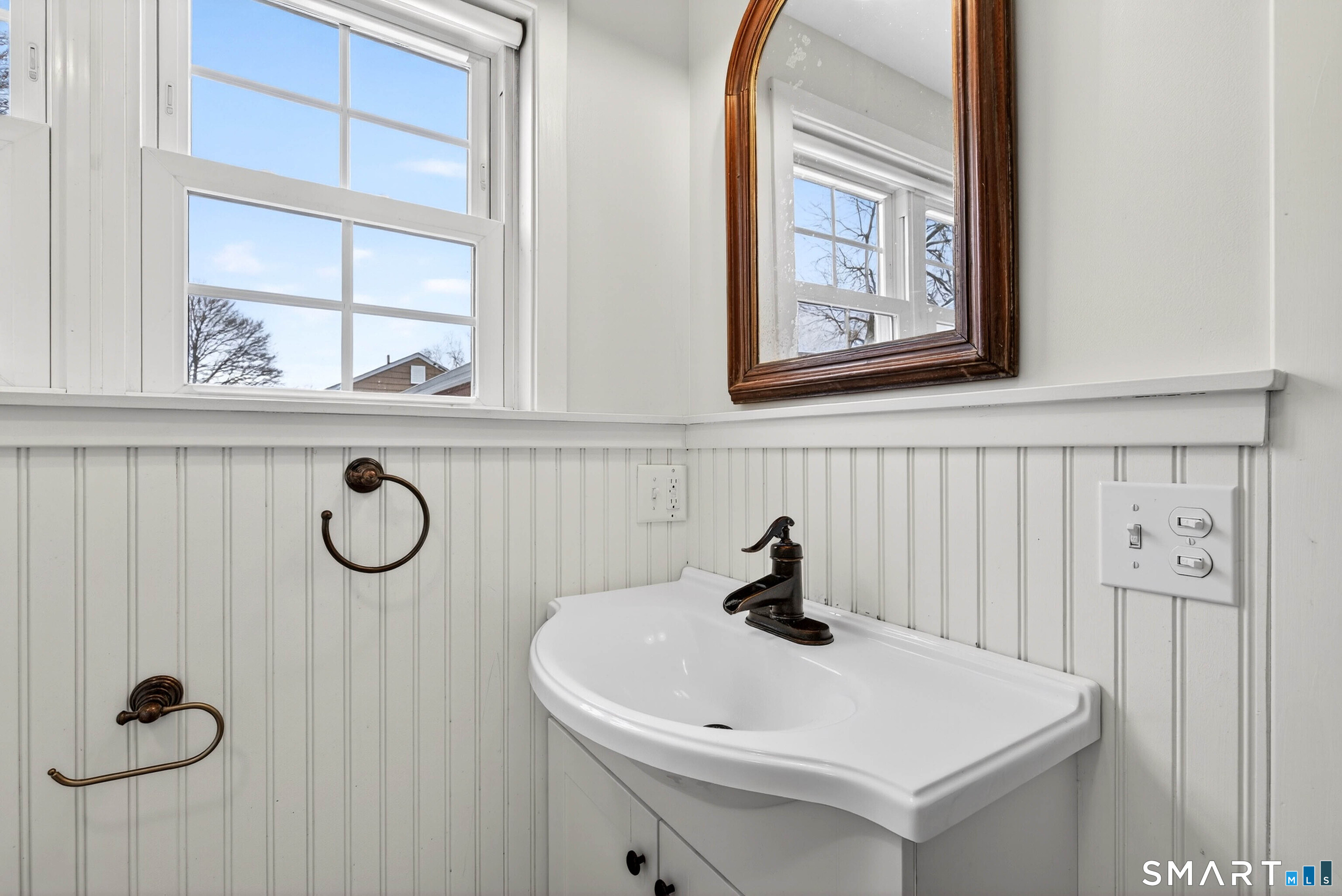 25 Pond Road Old Saybrook, CT 06475 - Photo 18 of 40 a bathroom with a sink and a window
