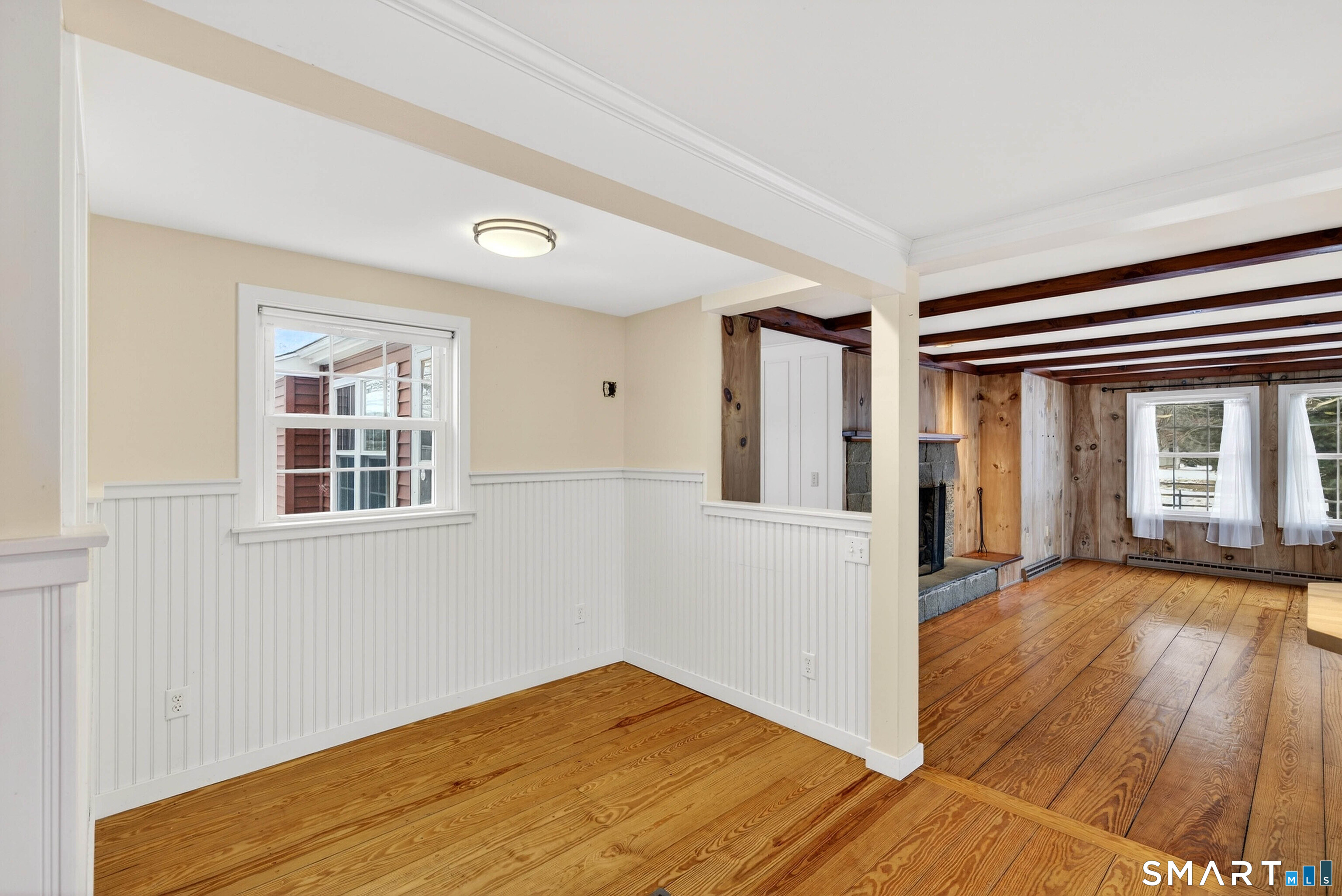 25 Pond Road Old Saybrook, CT 06475 - Photo 20 of 40 a view of an empty room with wooden floor and a window