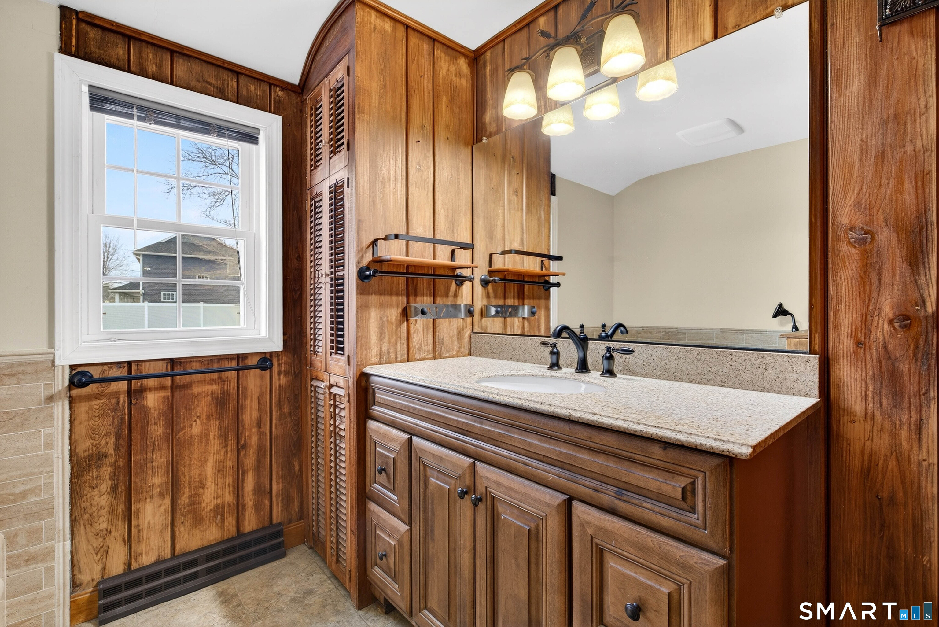 25 Pond Road Old Saybrook, CT 06475 - Photo 25 of 40 a bathroom with a sink vanity and a mirror