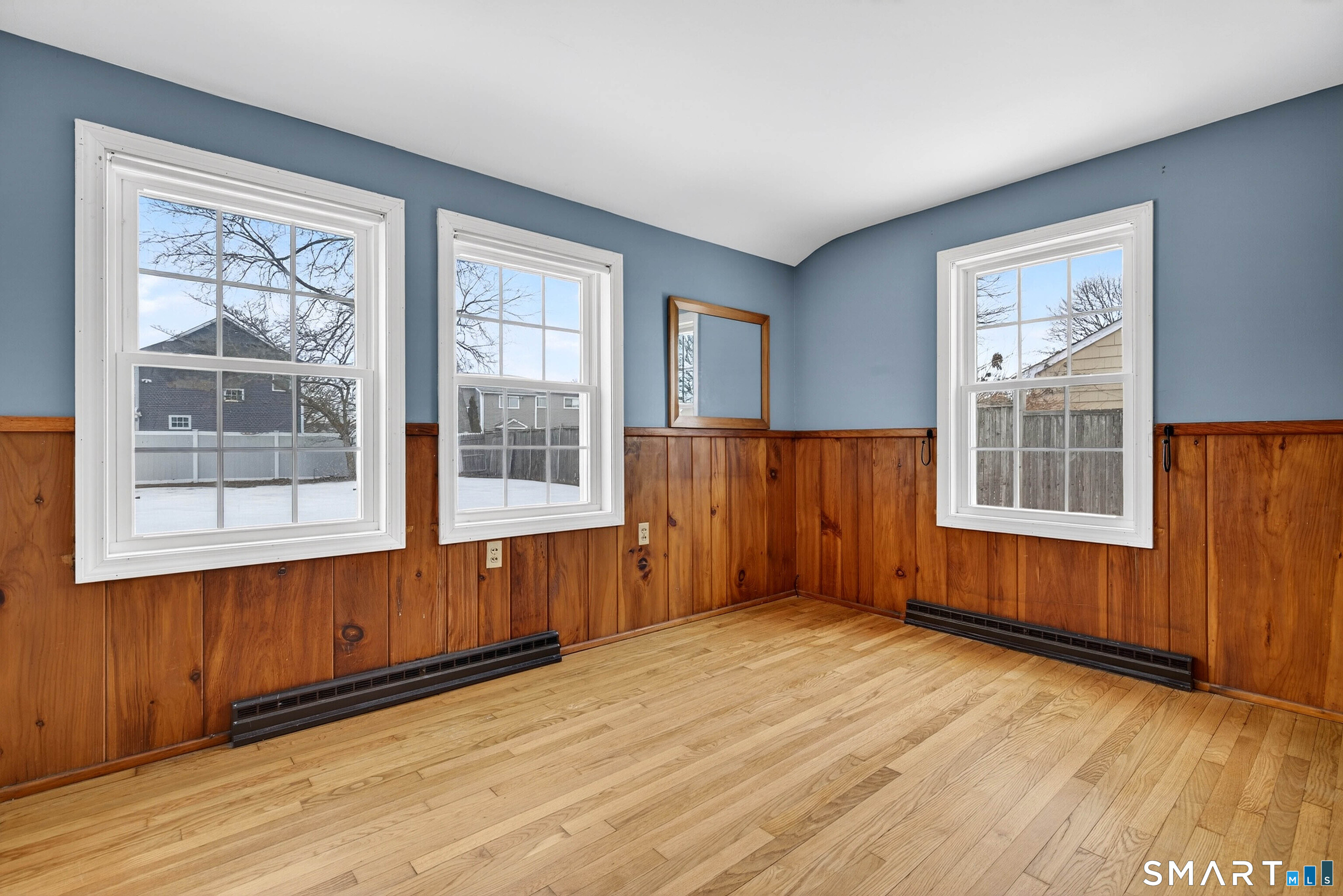 25 Pond Road Old Saybrook, CT 06475 - Photo 26 of 40 an empty room with wooden floor and windows