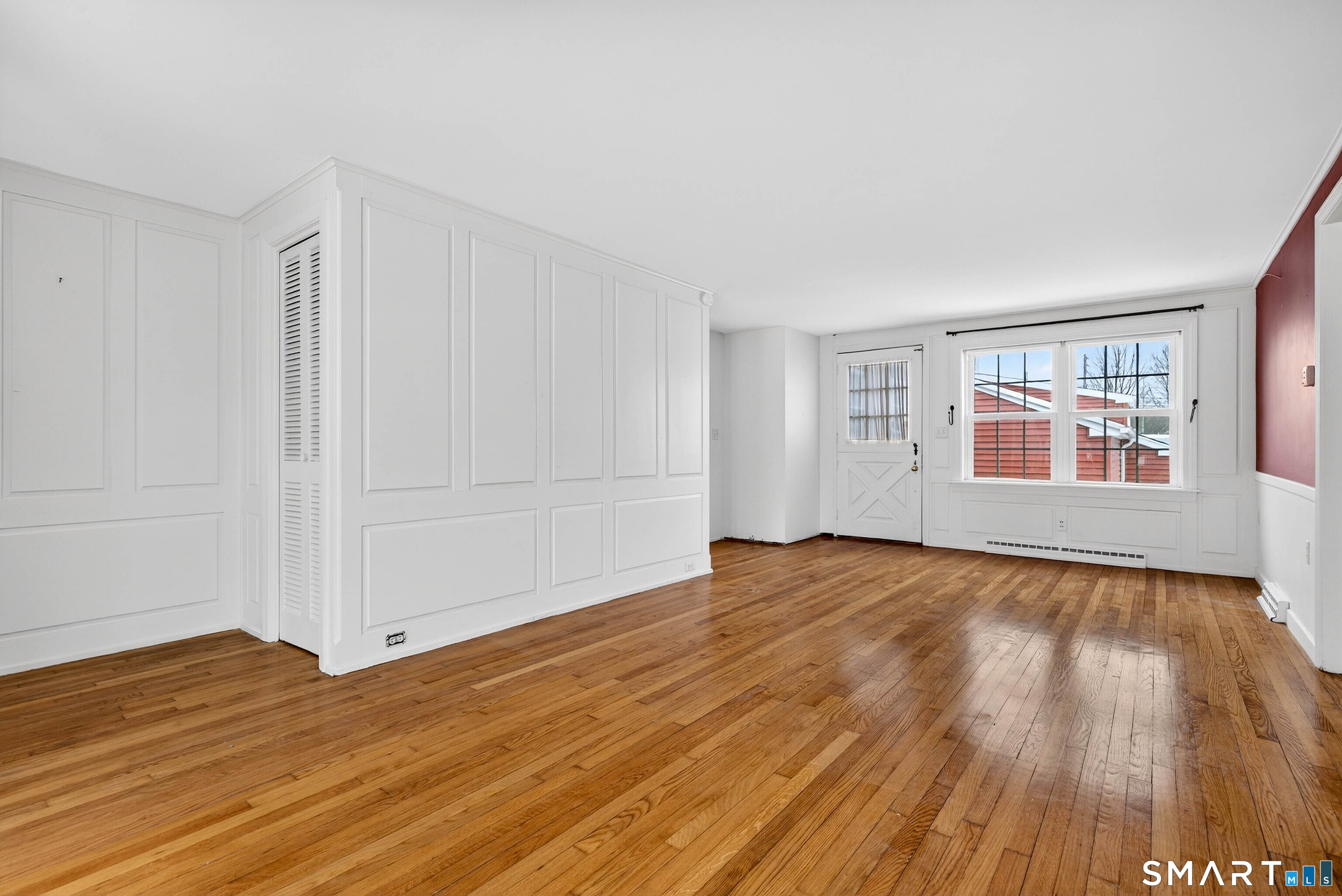25 Pond Road Old Saybrook, CT 06475 - Photo 6 of 40 a view of empty room with wooden floor and fan