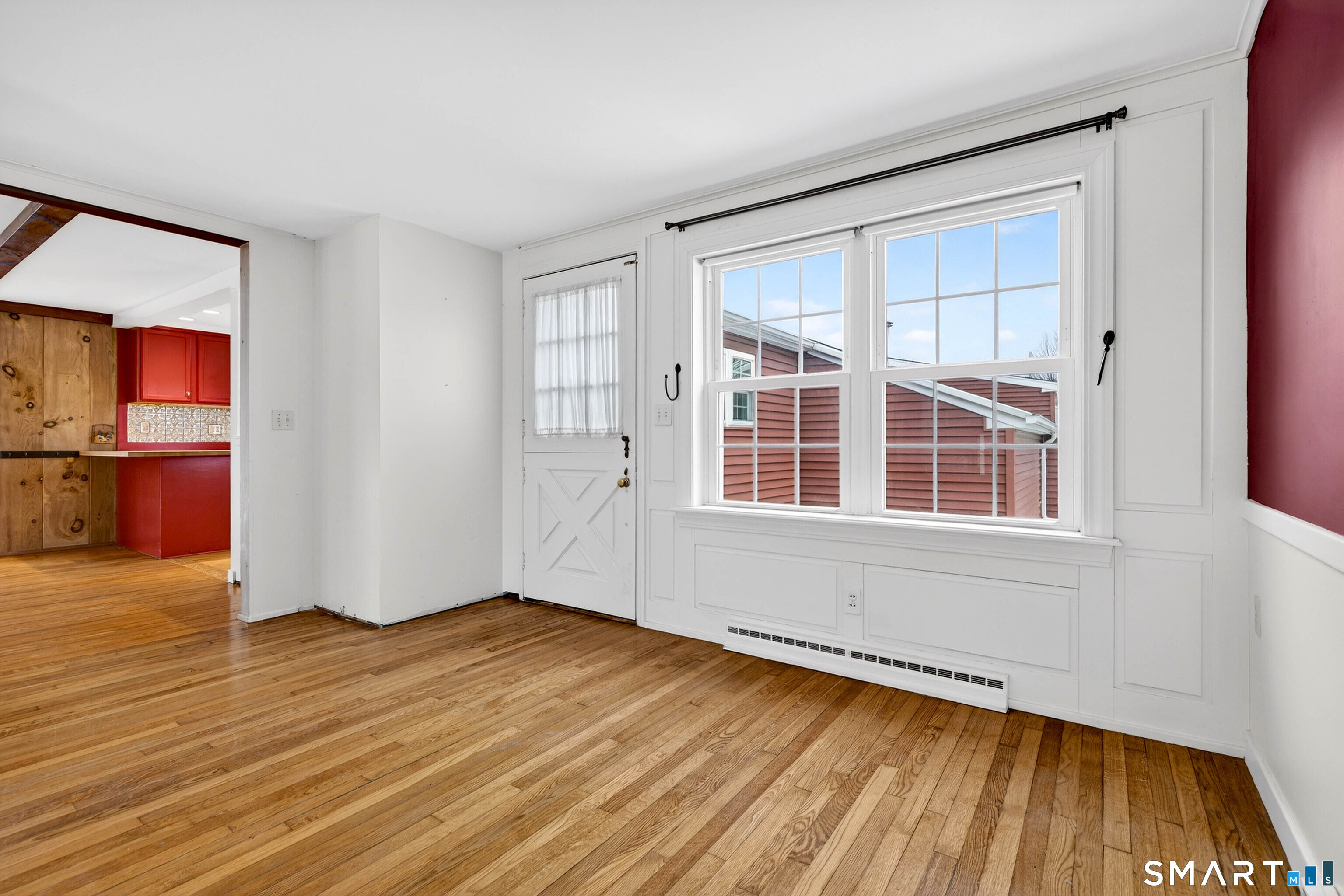 25 Pond Road Old Saybrook, CT 06475 - Photo 7 of 40 an empty room with wooden floor and windows