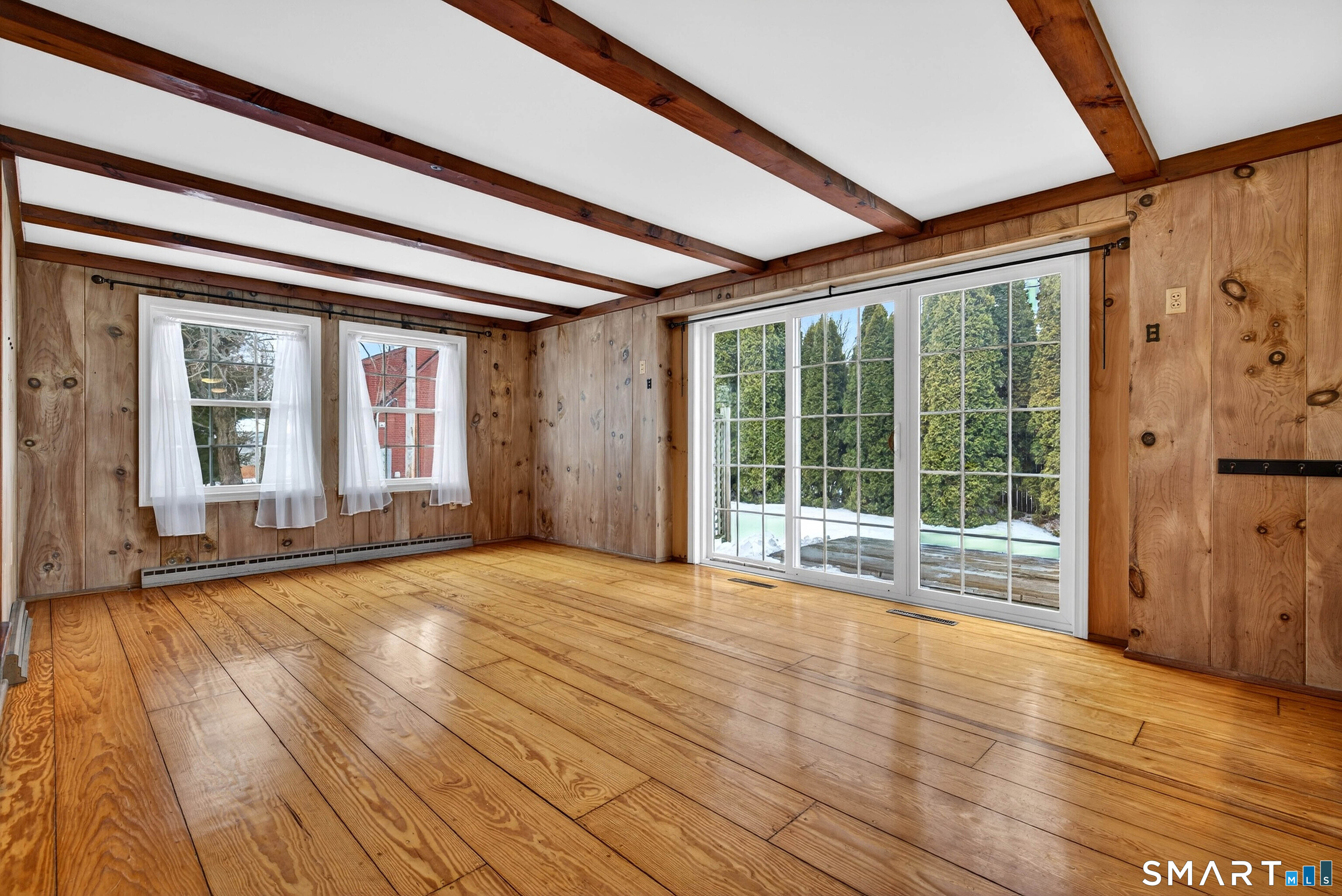 25 Pond Road Old Saybrook, CT 06475 - Photo 8 of 40 a view of an empty room with wooden floor and a window