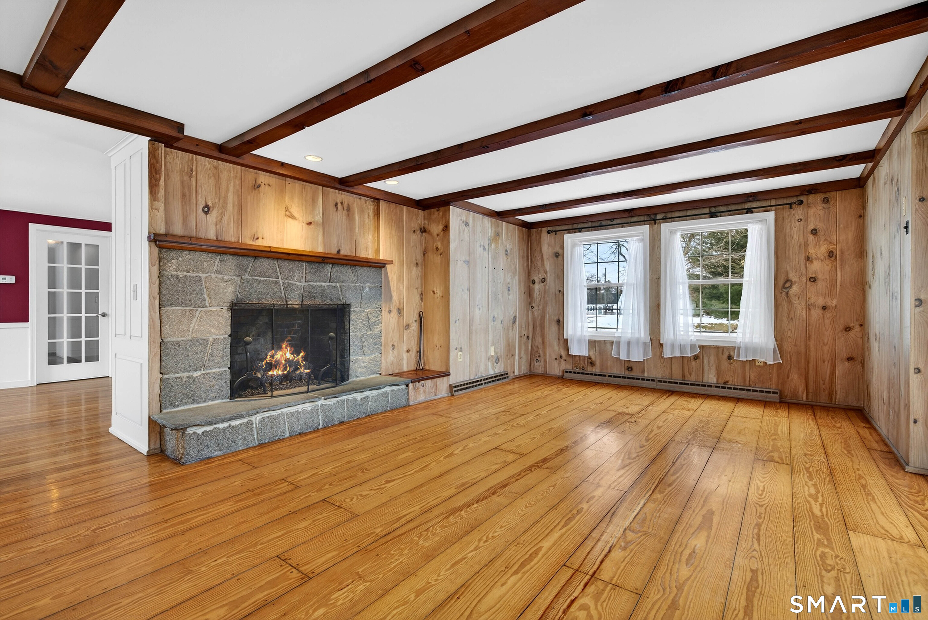25 Pond Road Old Saybrook, CT 06475 - Photo 9 of 40 a view of an empty room with wooden floor fireplace and a window