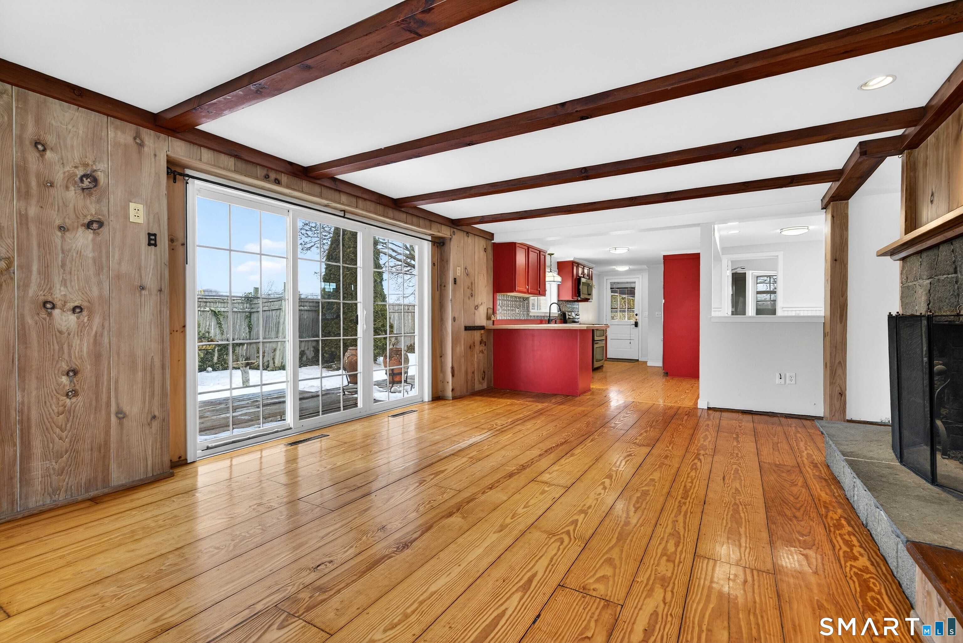 25 Pond Road Old Saybrook, CT 06475 - Photo 10 of 40 a view of empty room with wooden floor and fireplace