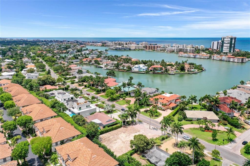 3880 Crayton Road Naples, FL 34103 - Photo 12 of 13 an aerial view of a city with lake view