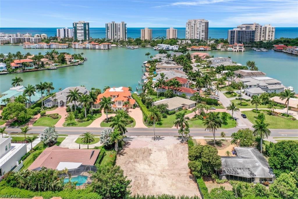 3880 Crayton Road Naples, FL 34103 - Photo 13 of 13 a view of a city with tall buildings