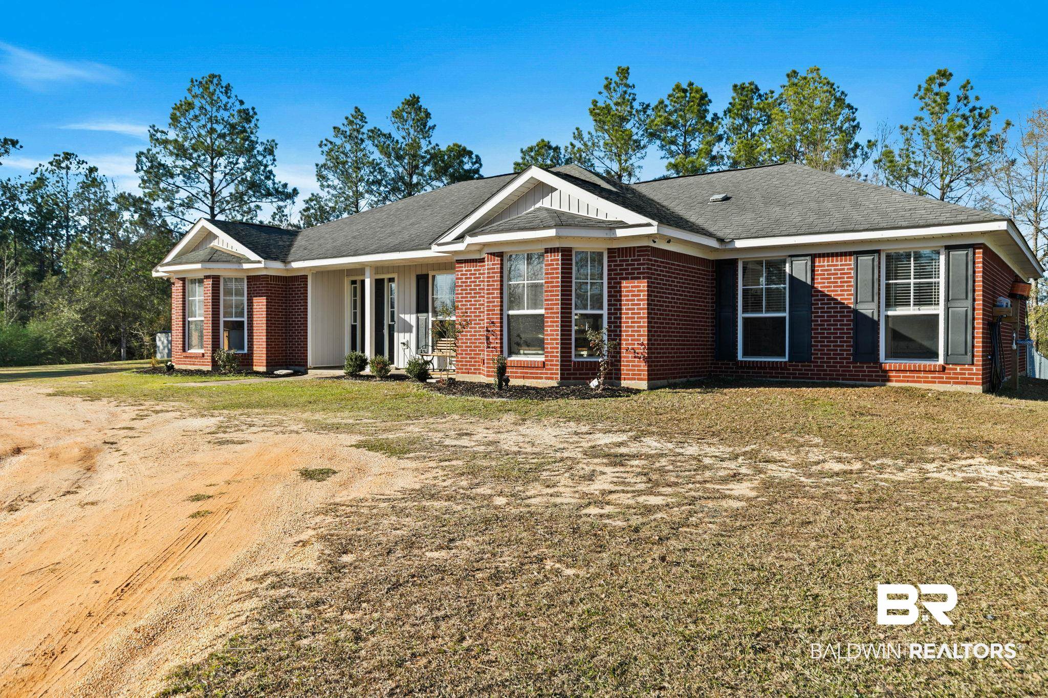 55750 Lottie Road Perdido, AL 36562 - Photo 76 of 84 Ranch-style house with a front lawn, brick siding, and roof with shingles