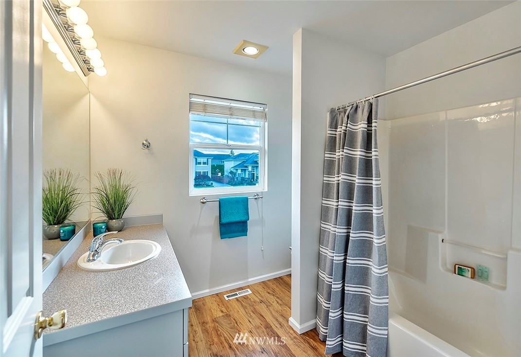 3131 178th Street Southeast Bothell, WA 98012 - Photo 22 of 29 a view of bathroom with a tub shower and sink