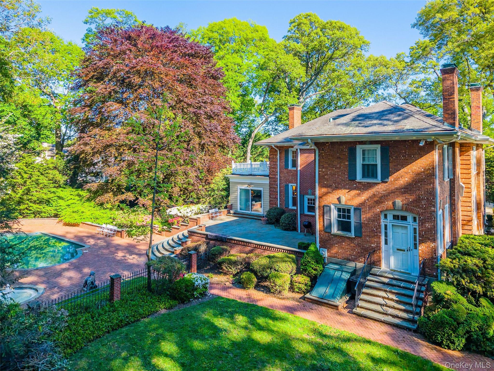 23 Townsend Road Glen Cove, NY 11542 - Photo 3 of 23 front view of a house with a yard