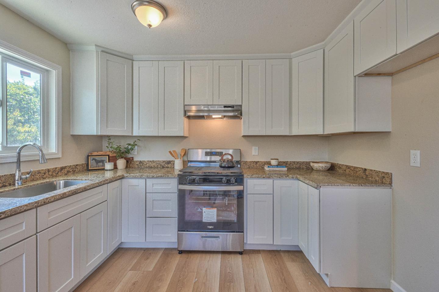 104 Inca Drive Soledad, CA 93960 - Photo 11 of 28 a kitchen with a sink and cabinets