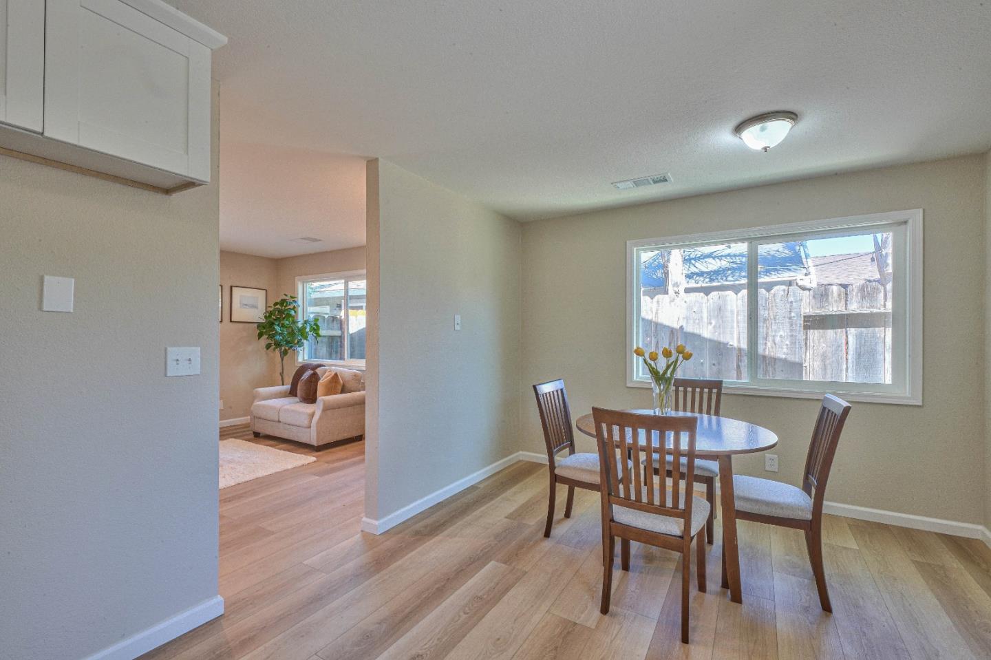 104 Inca Drive Soledad, CA 93960 - Photo 12 of 28 a view of a dining room with furniture window and wooden floor