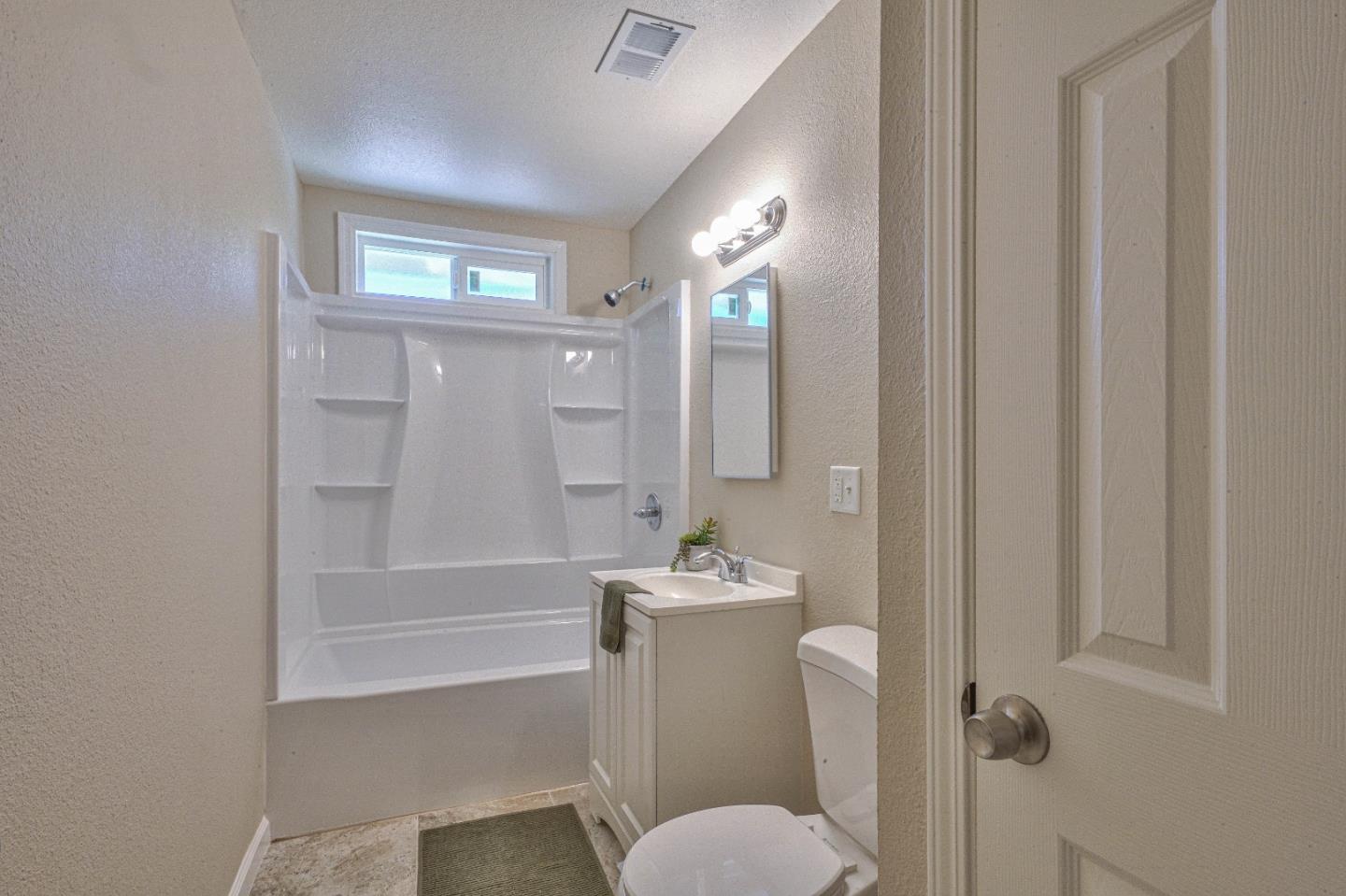 104 Inca Drive Soledad, CA 93960 - Photo 21 of 28 a bathroom with a sink a toilet and shower