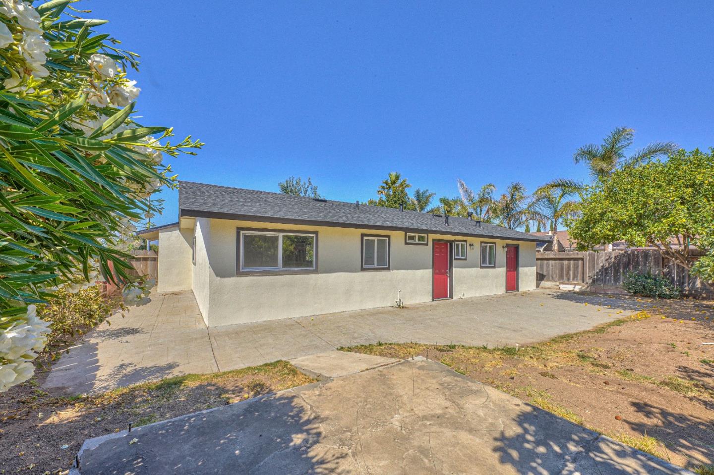 104 Inca Drive Soledad, CA 93960 - Photo 26 of 28 a front view of a house with a yard and garage