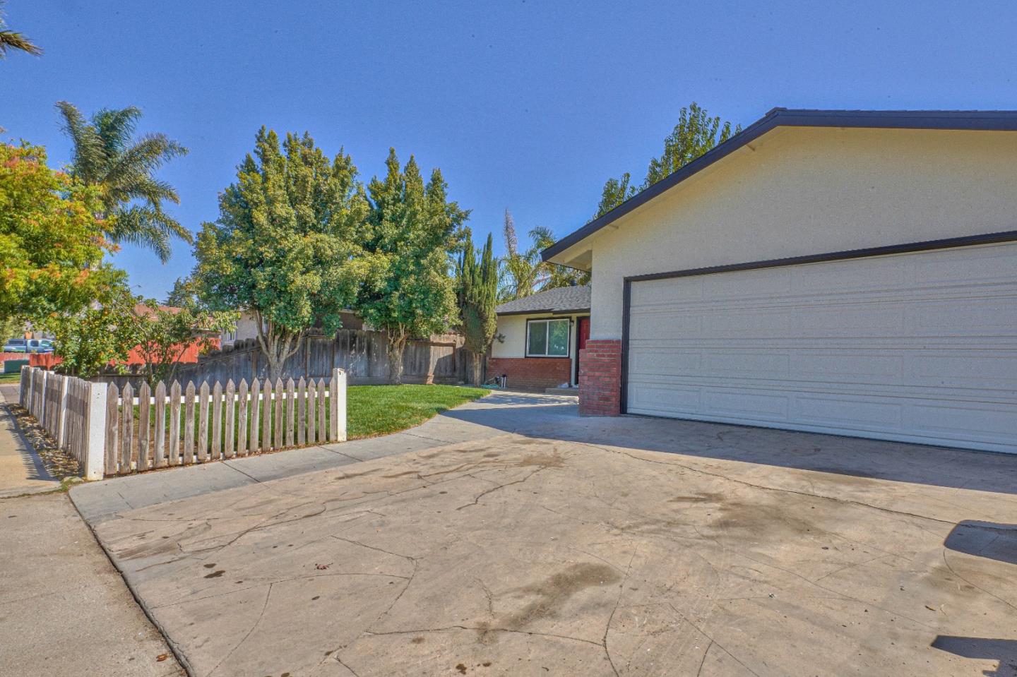 104 Inca Drive Soledad, CA 93960 - Photo 28 of 28 a view of a house with a small yard and floor to ceiling window and tree