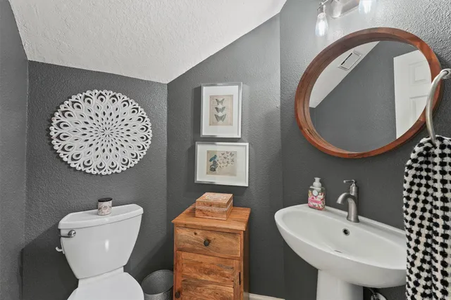 a bed room with a bed and a chandelier