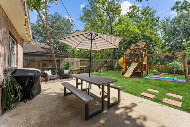 a view of a park with large trees