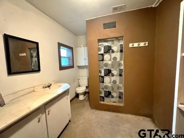 a bathroom with a sink and mirror