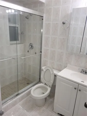 a bathroom with a shower and a toilet