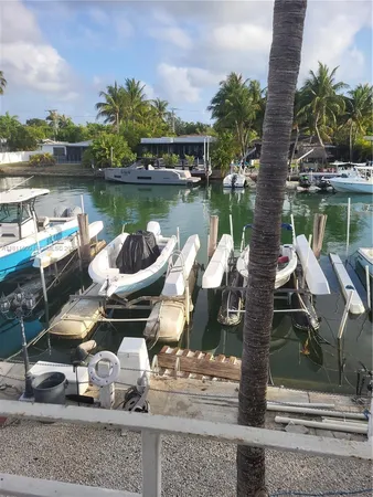 a view of a chairs and table in a patio