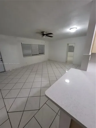 a view of an empty room and window