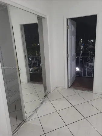 a view of an empty room with windows