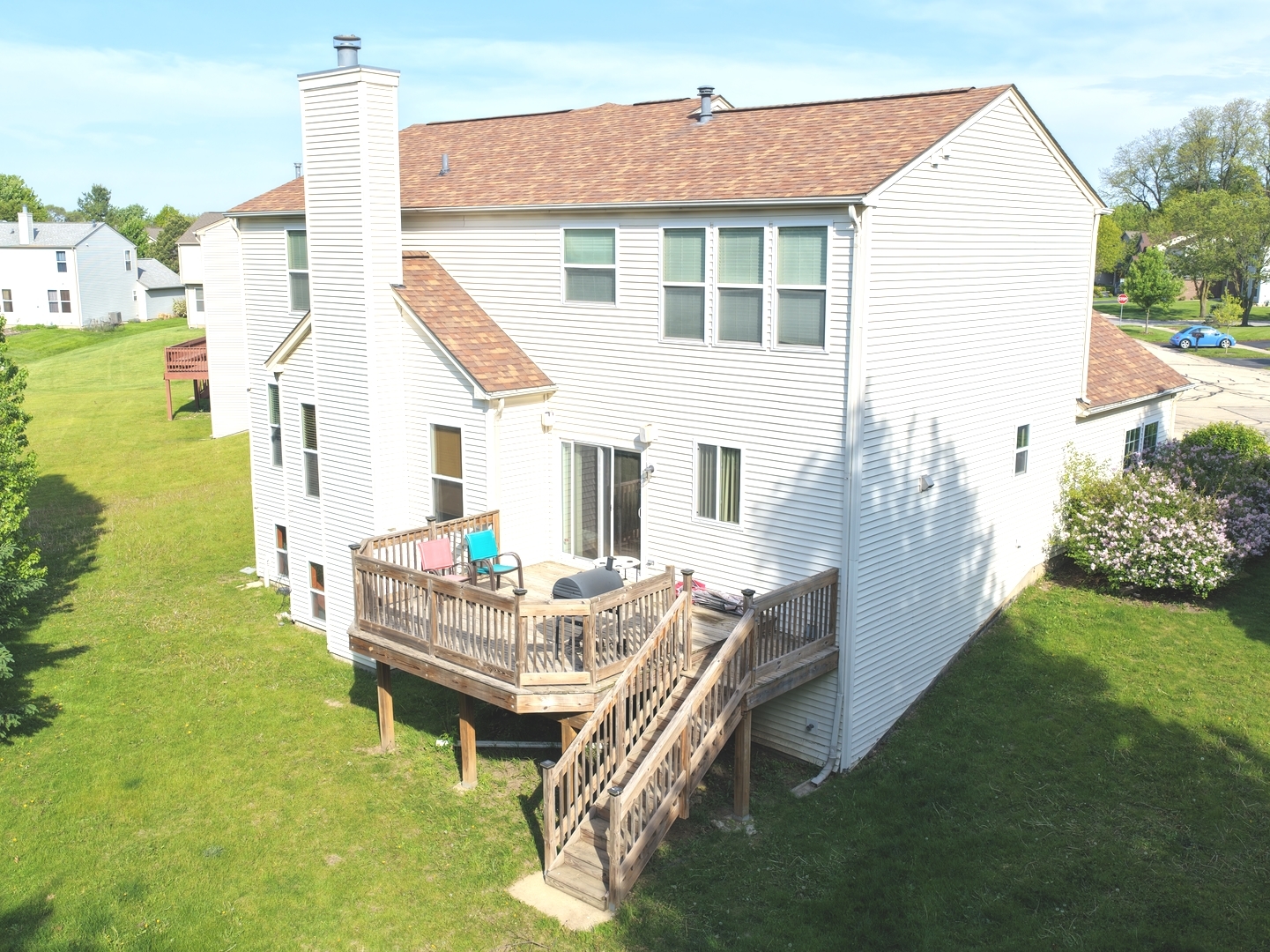 6 Forsythia Court Bolingbrook, IL 60490 - Photo 26 of 28 a backyard of a house with a garden and barbeque oven