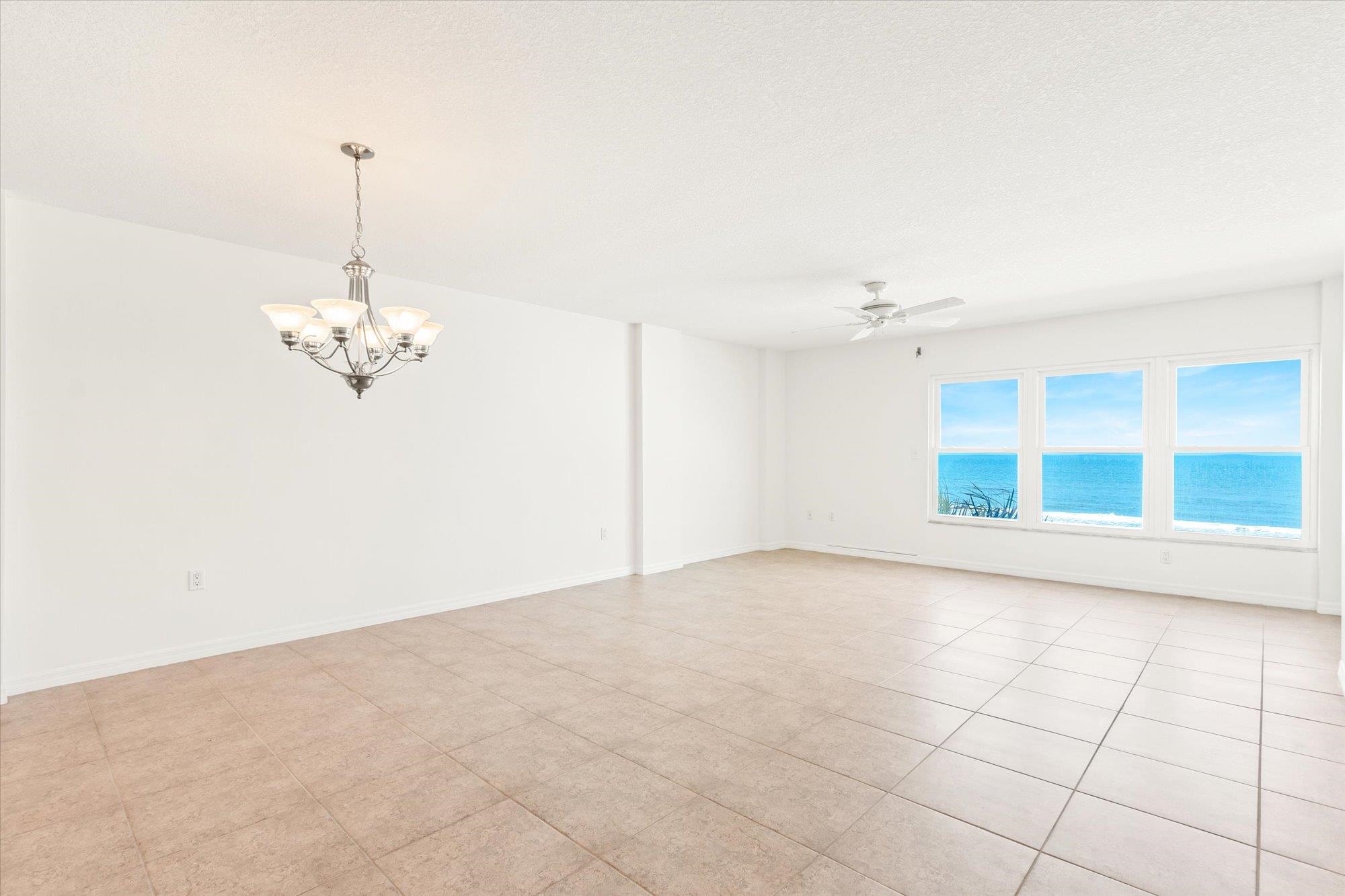 8090 A1A South, Unit 406 St. Augustine, FL 32080 - Photo 11 of 42 a view of a livingroom with a chandelier fan