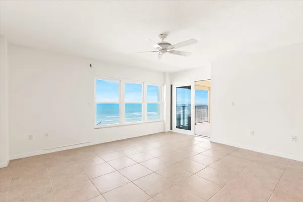 a view of an empty room with a window
