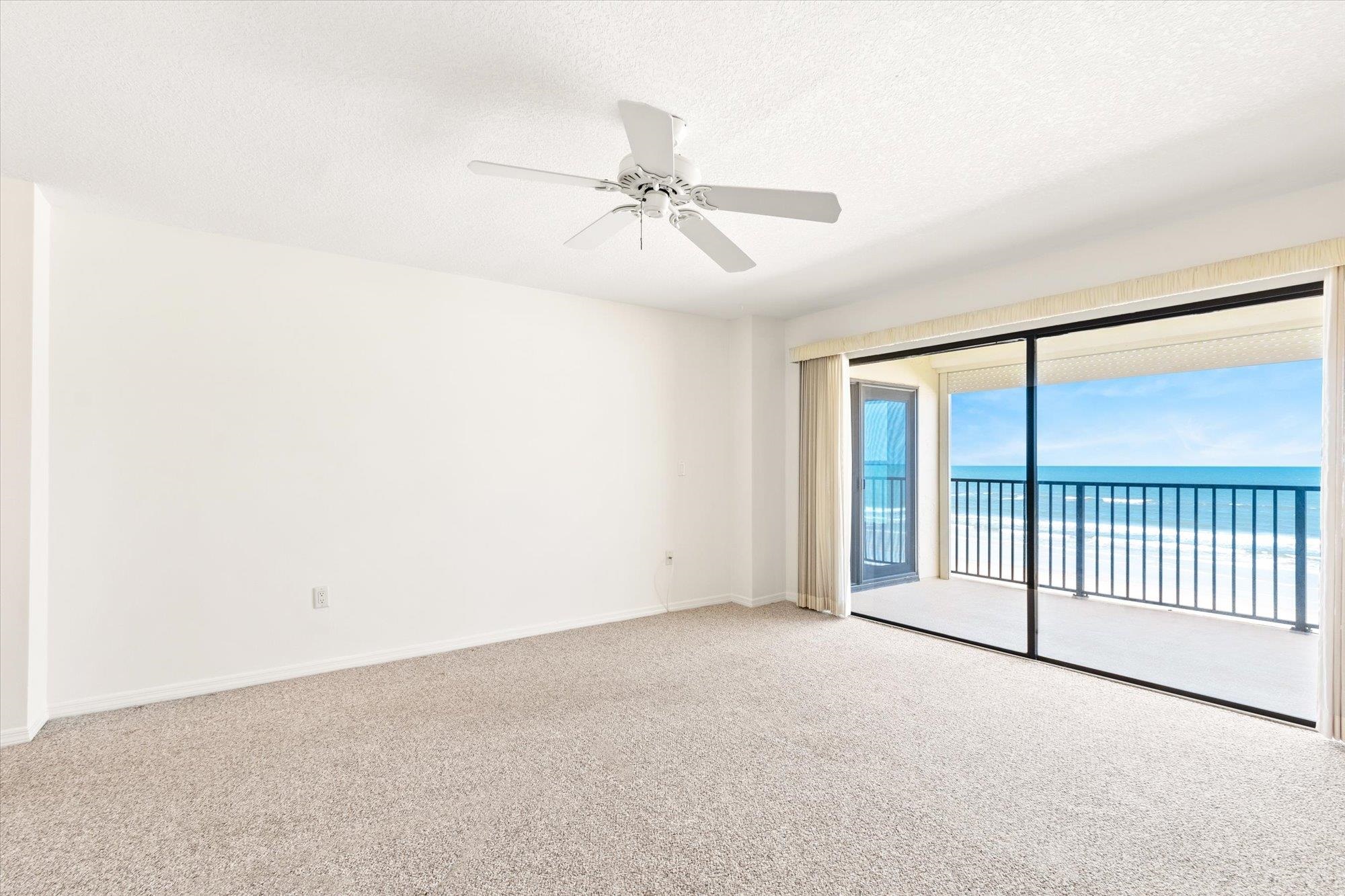 8090 A1A South, Unit 406 St. Augustine, FL 32080 - Photo 16 of 42 an empty room with fan