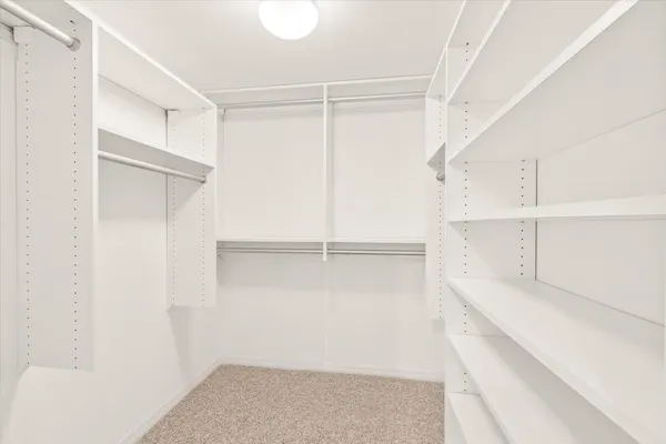 a view of an empty walk in closet
