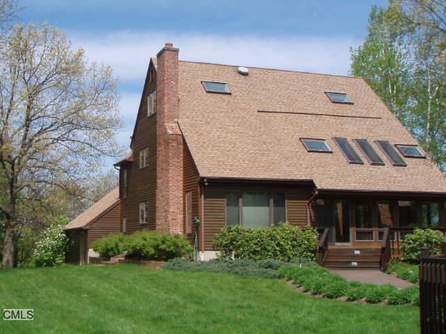 98 Obtuse Road South Brookfield, CT 06804 - Photo 1 of 1 a view of a house with brick walls and a yard with plants