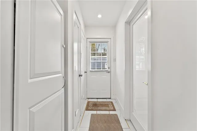 a spacious bedroom with a bed and a couch