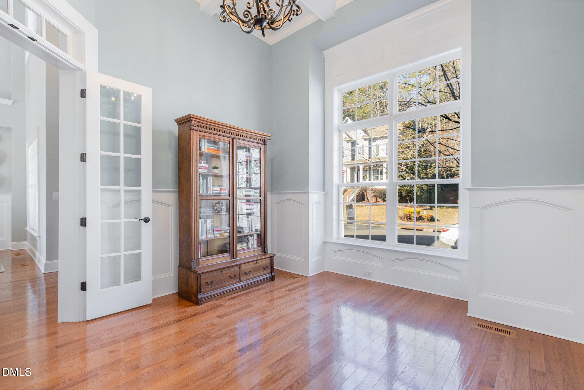 8517 Stonechase Drive Raleigh, NC 27613 - Photo 19 of 37 an empty room with wooden floor and windows