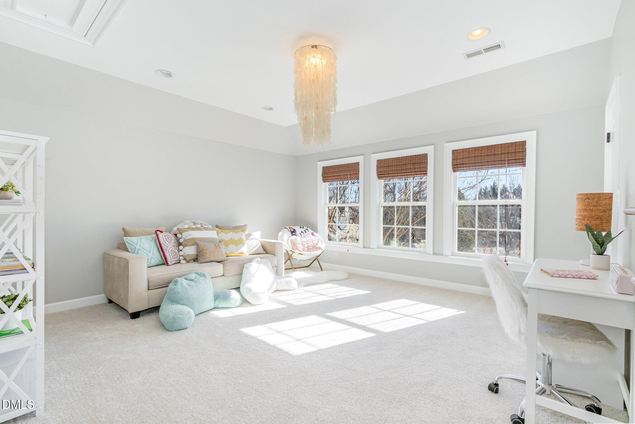 8517 Stonechase Drive Raleigh, NC 27613 - Photo 23 of 37 a living room with furniture and a large window