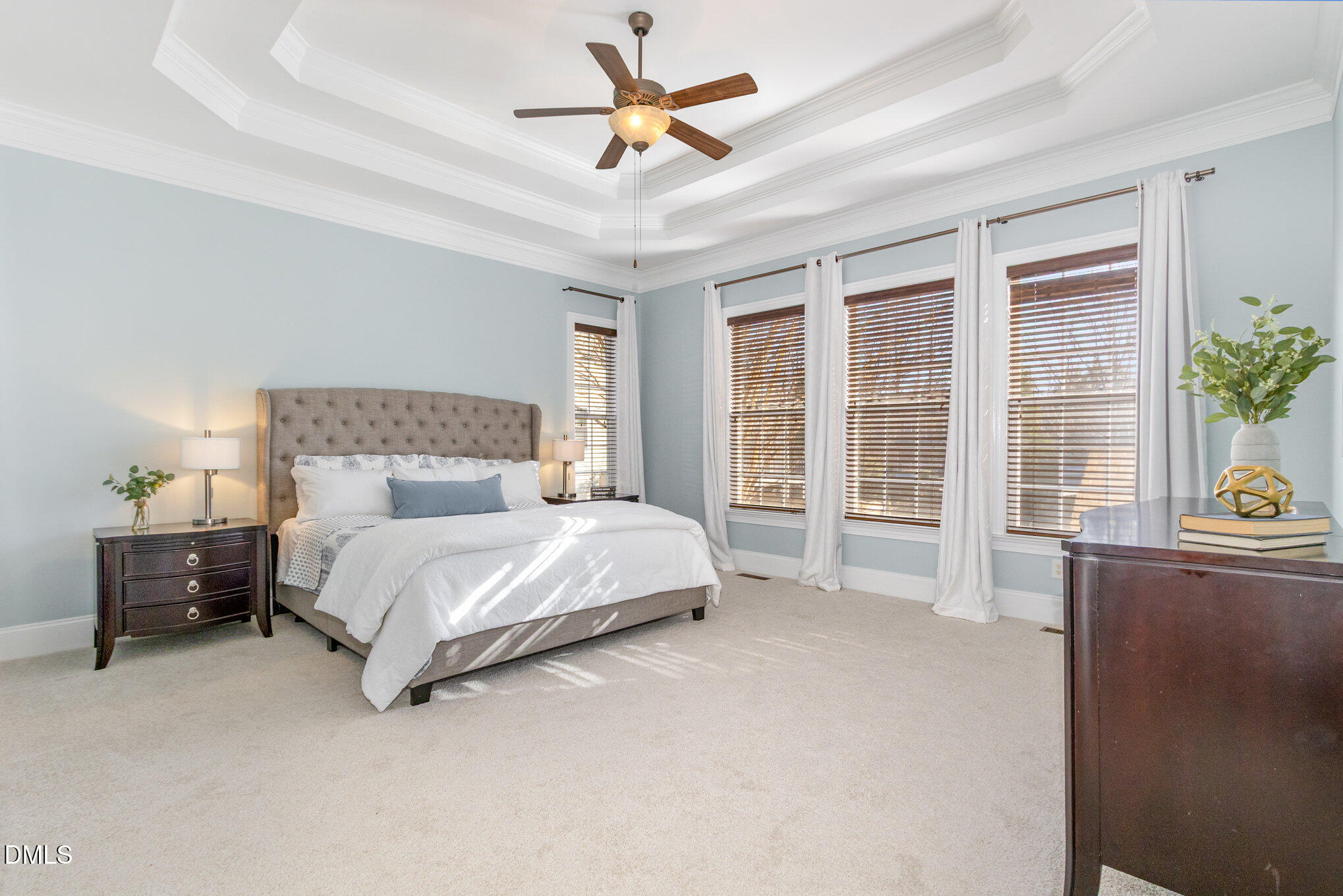 8517 Stonechase Drive Raleigh, NC 27613 - Photo 24 of 37 a spacious bedroom with a bed and a table