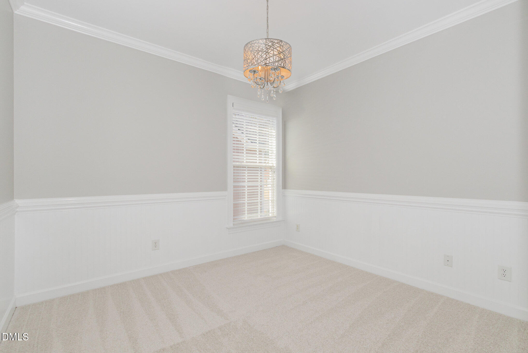 8517 Stonechase Drive Raleigh, NC 27613 - Photo 30 of 37 a view of empty room with window and chandelier