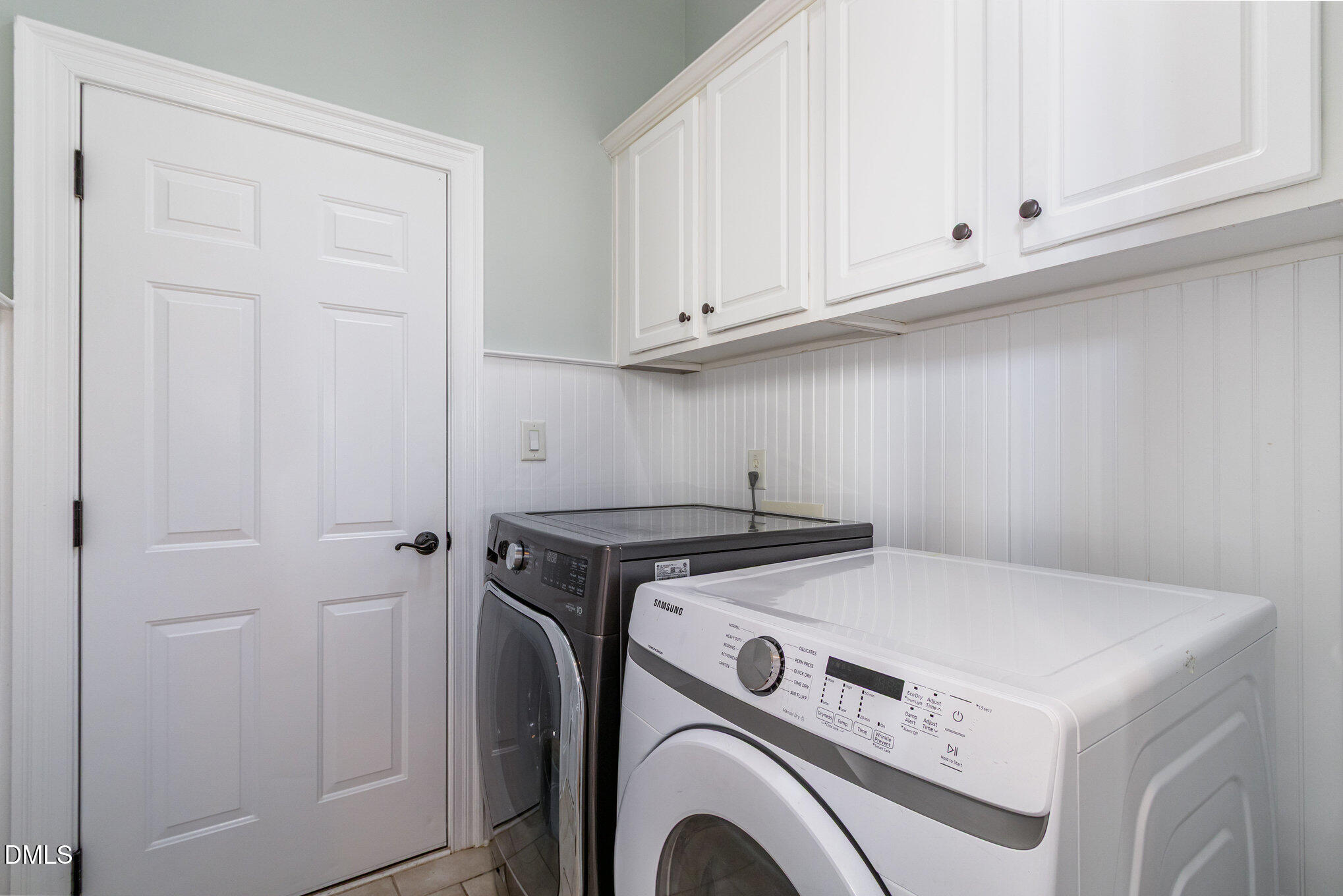 8517 Stonechase Drive Raleigh, NC 27613 - Photo 33 of 37 a utility room with dryer and washer