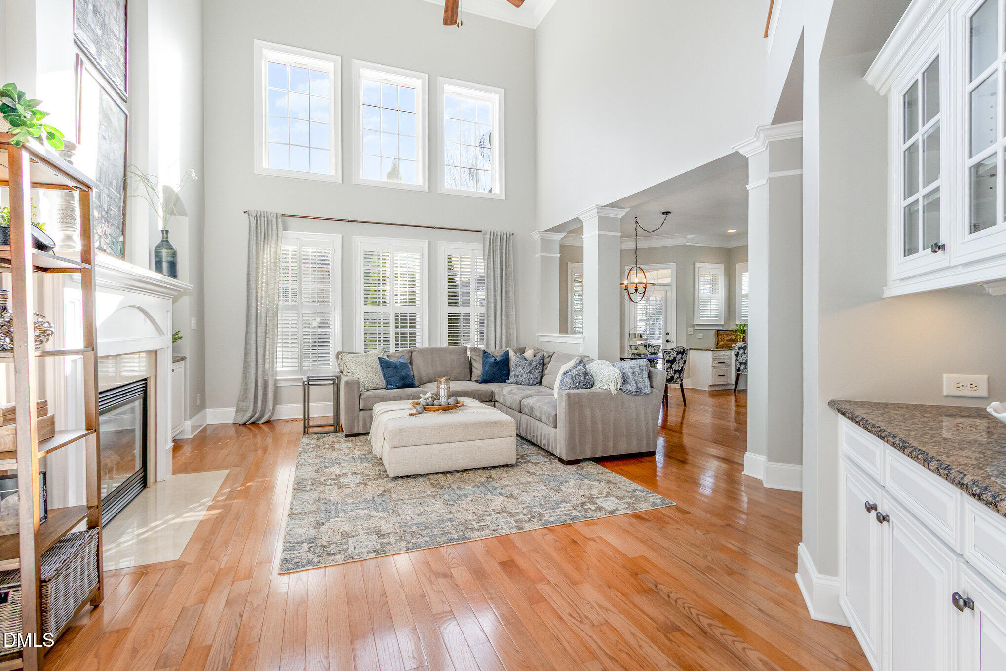 8517 Stonechase Drive Raleigh, NC 27613 - Photo 5 of 37 a living room with furniture fireplace and wooden floor