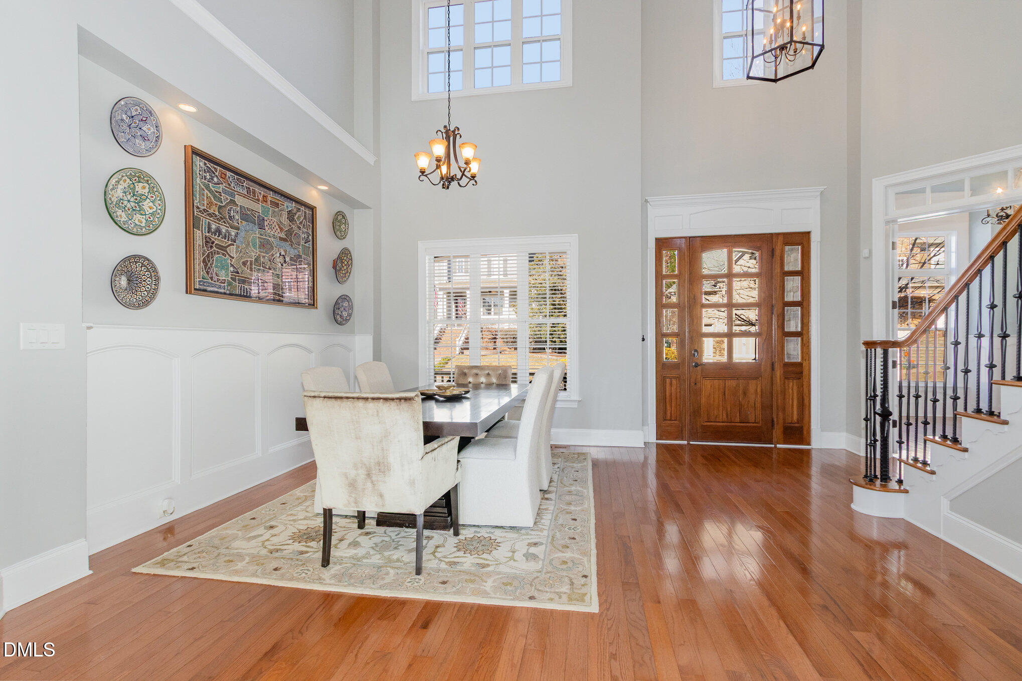 8517 Stonechase Drive Raleigh, NC 27613 - Photo 8 of 37 a view of a dining room with furniture and wooden floor