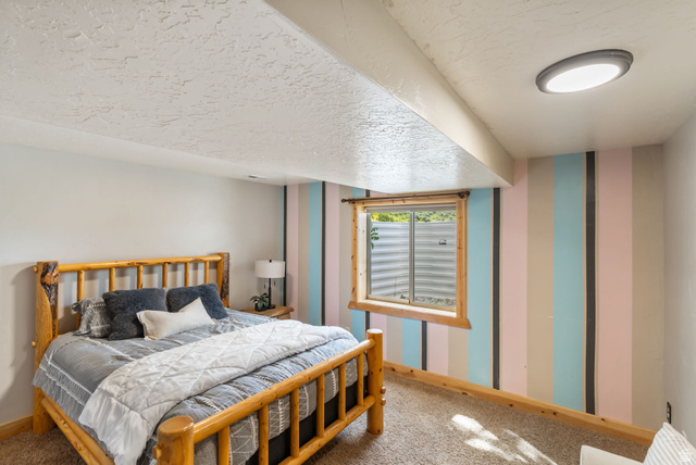 2013 North River View Road Huntsville, UT 84317 - Photo 29 of 53 Carpeted bedroom with wallpapered walls and a textured ceiling