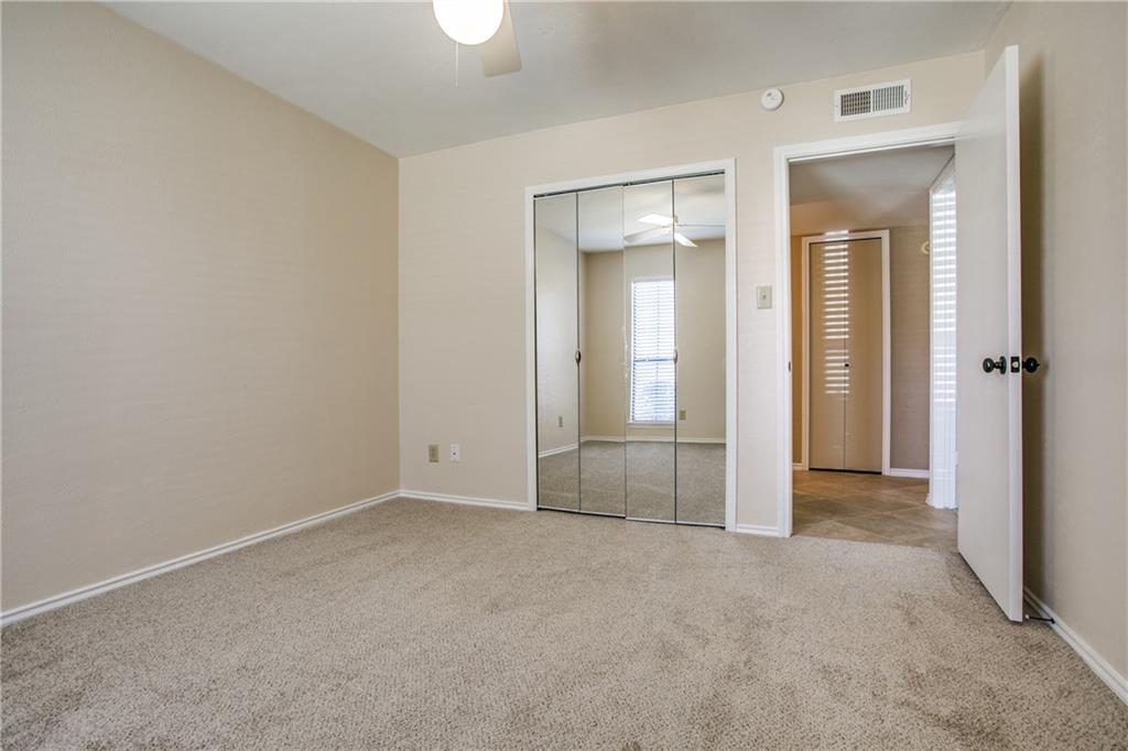 1318 Springview Drive Allen, TX 75002 - Photo 19 of 35 an empty room with closet and a bathroom