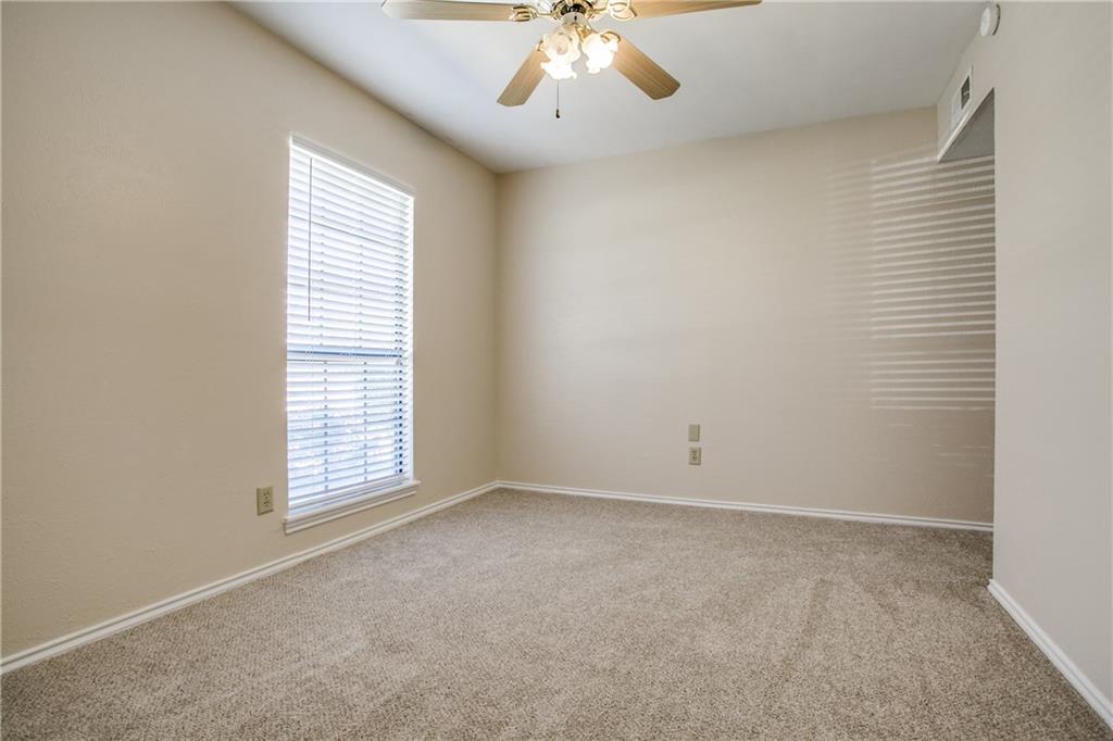 1318 Springview Drive Allen, TX 75002 - Photo 21 of 35 an empty room with windows and fan