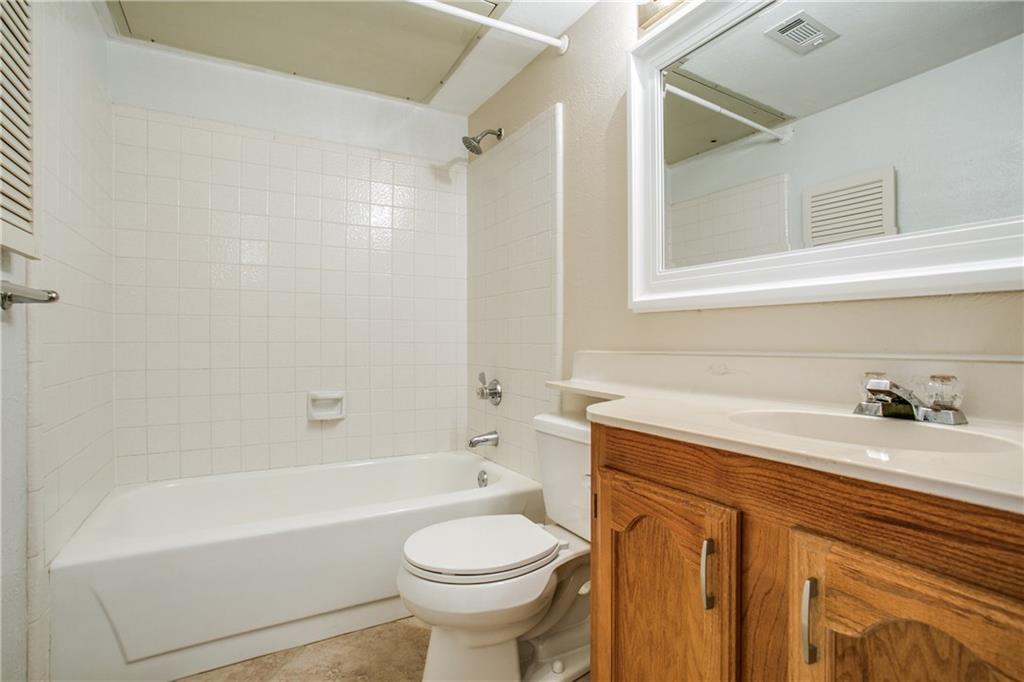 1318 Springview Drive Allen, TX 75002 - Photo 28 of 35 a bathroom with a sink a toilet and a bathtub