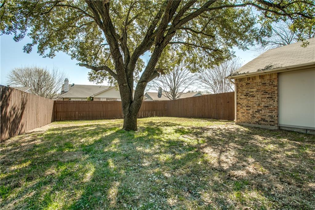 1318 Springview Drive Allen, TX 75002 - Photo 29 of 35 a view of a yard with a tree