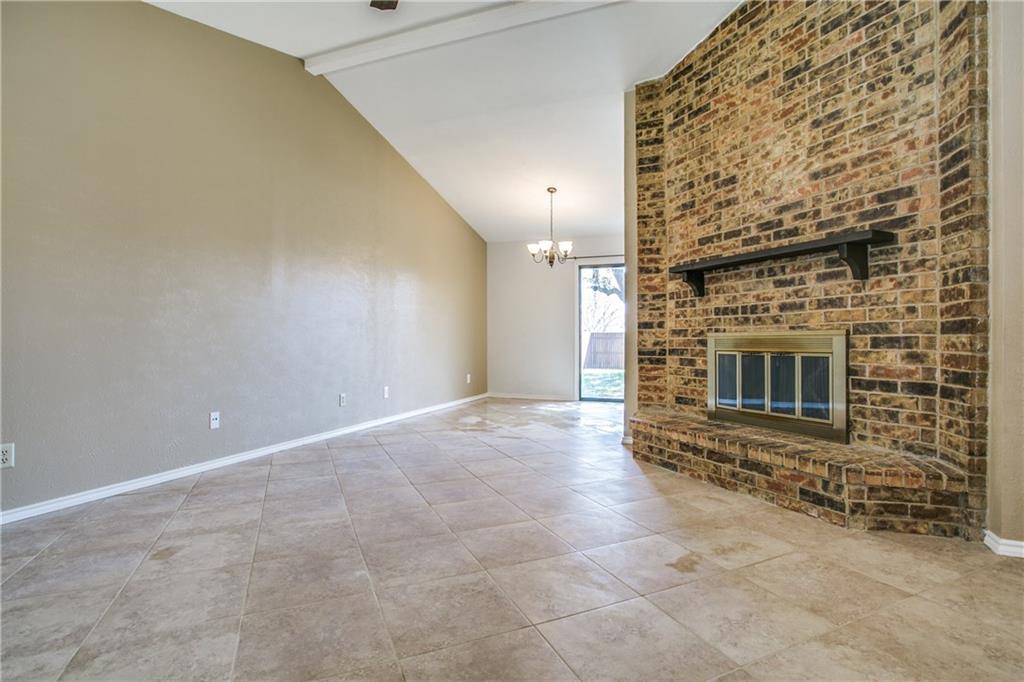 1318 Springview Drive Allen, TX 75002 - Photo 5 of 35 a view of an empty room and a fireplace