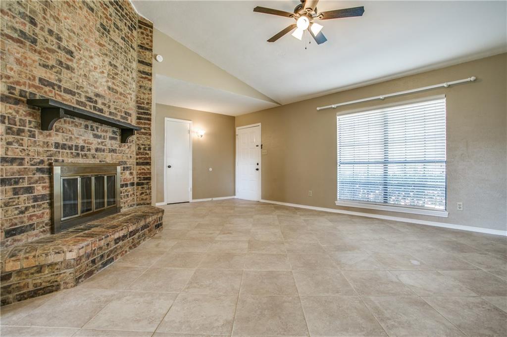1318 Springview Drive Allen, TX 75002 - Photo 8 of 35 a view of an empty room with a fireplace