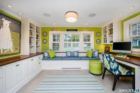 a spacious bedroom with a bed and a large window