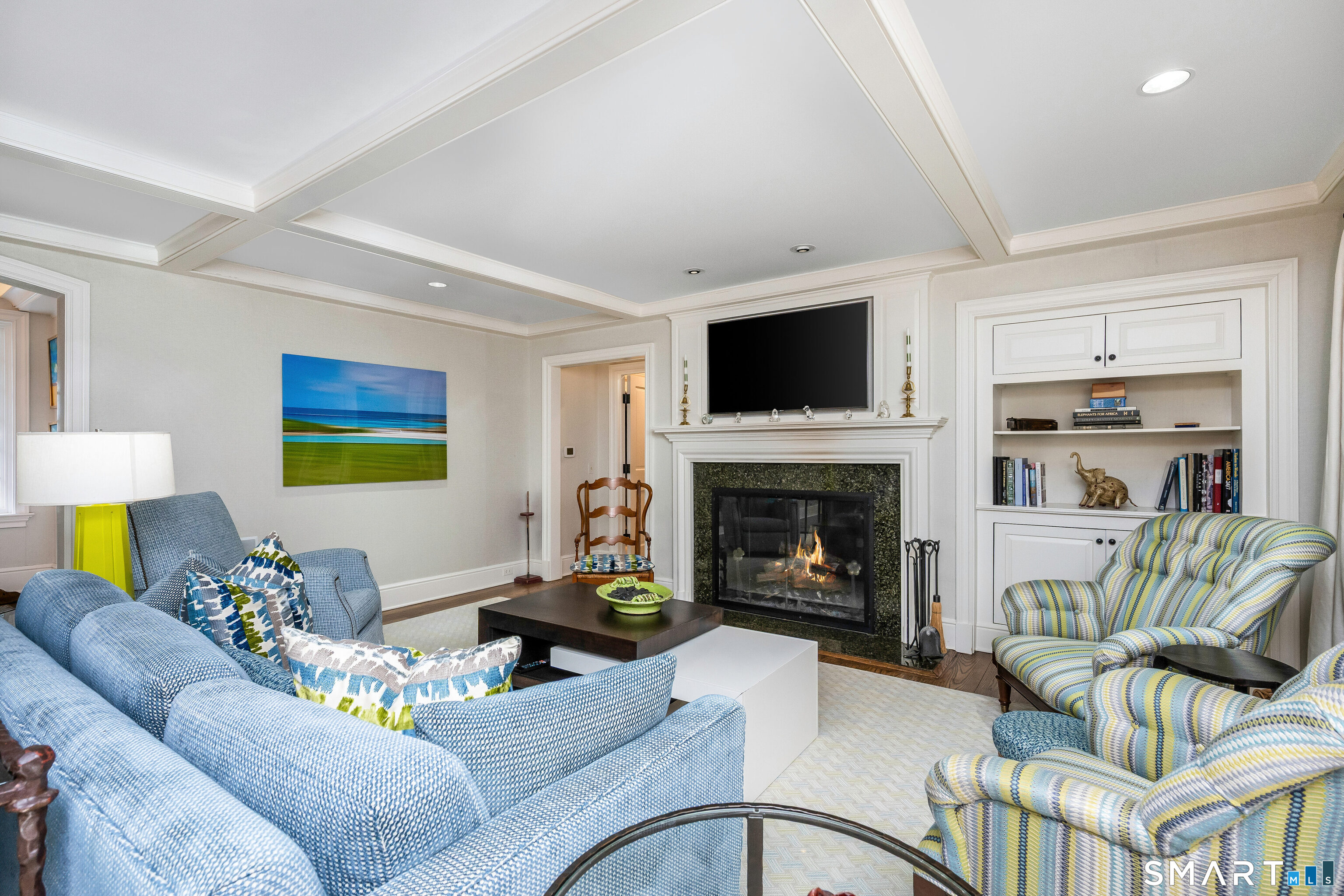 246 Brookside Road Darien, CT 06820 - Photo 15 of 40 a living room with furniture a flat screen tv and a fireplace