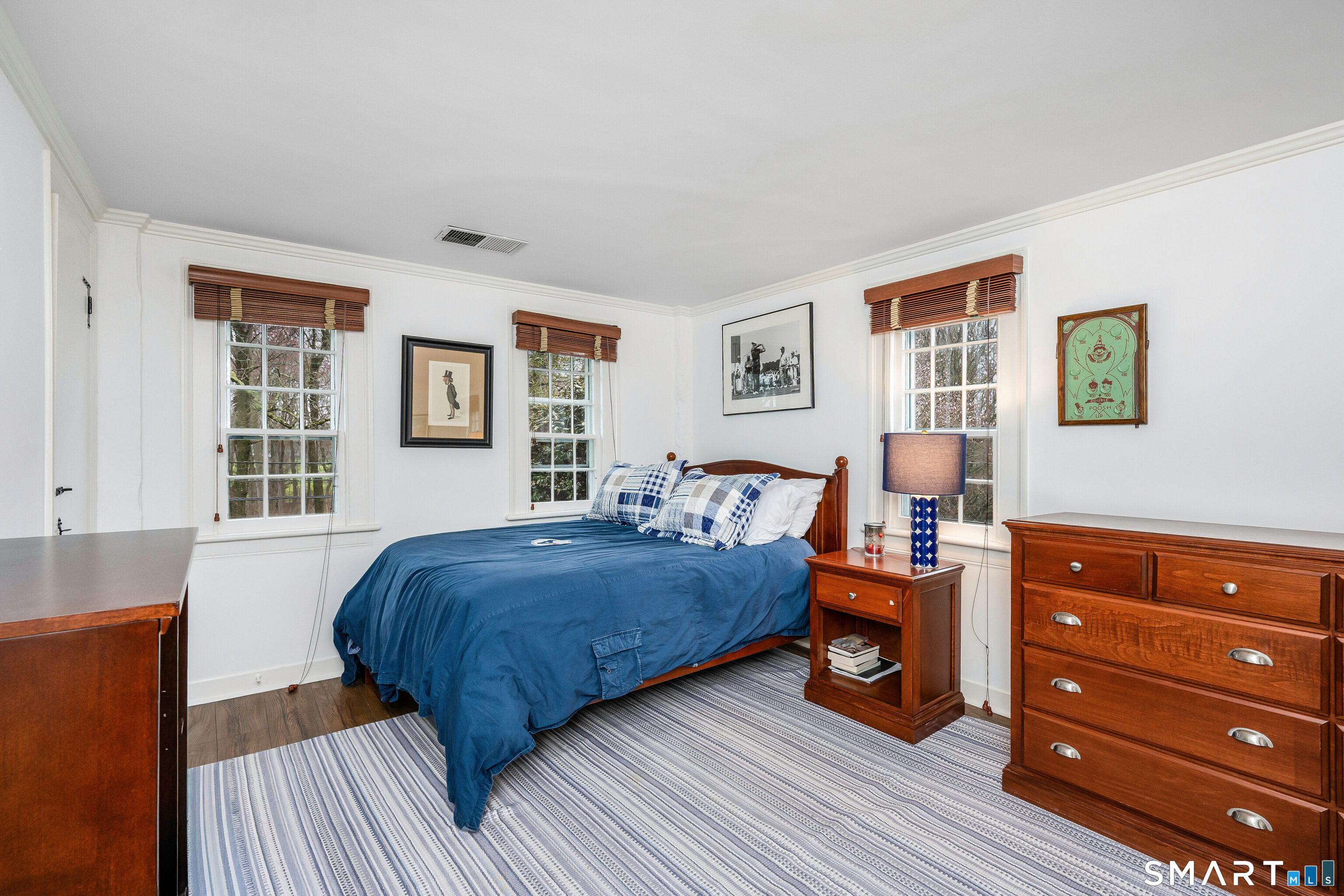 246 Brookside Road Darien, CT 06820 - Photo 19 of 40 a bed room with a bed and a dresser